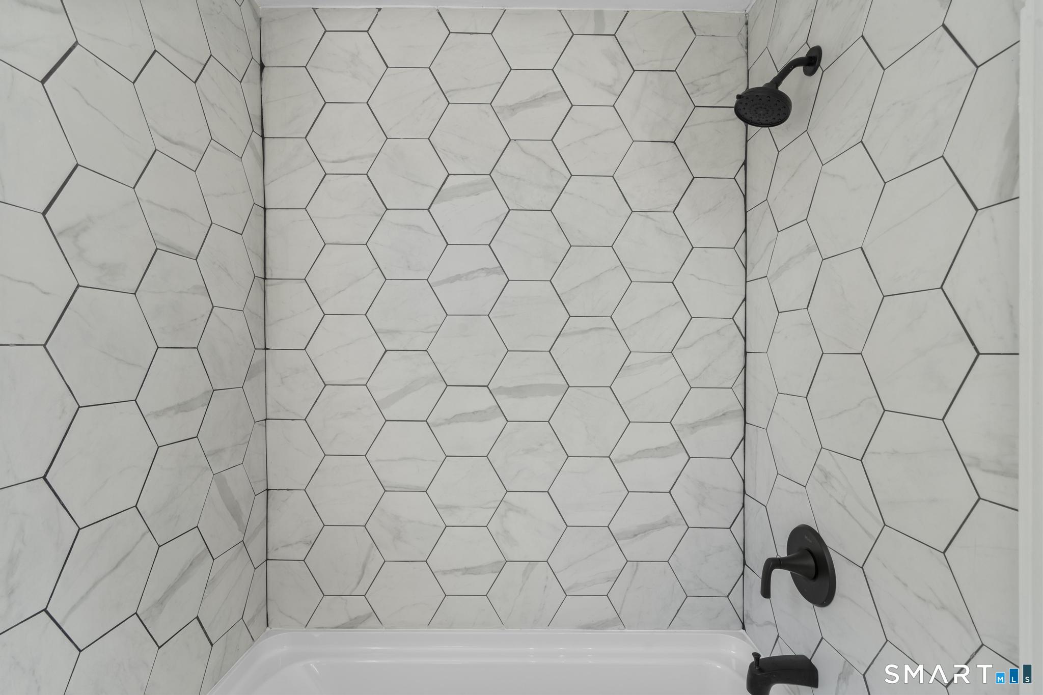94 3rd Street Hamden, CT 06514 - Photo 16 of 30 a bathroom with a white shower
