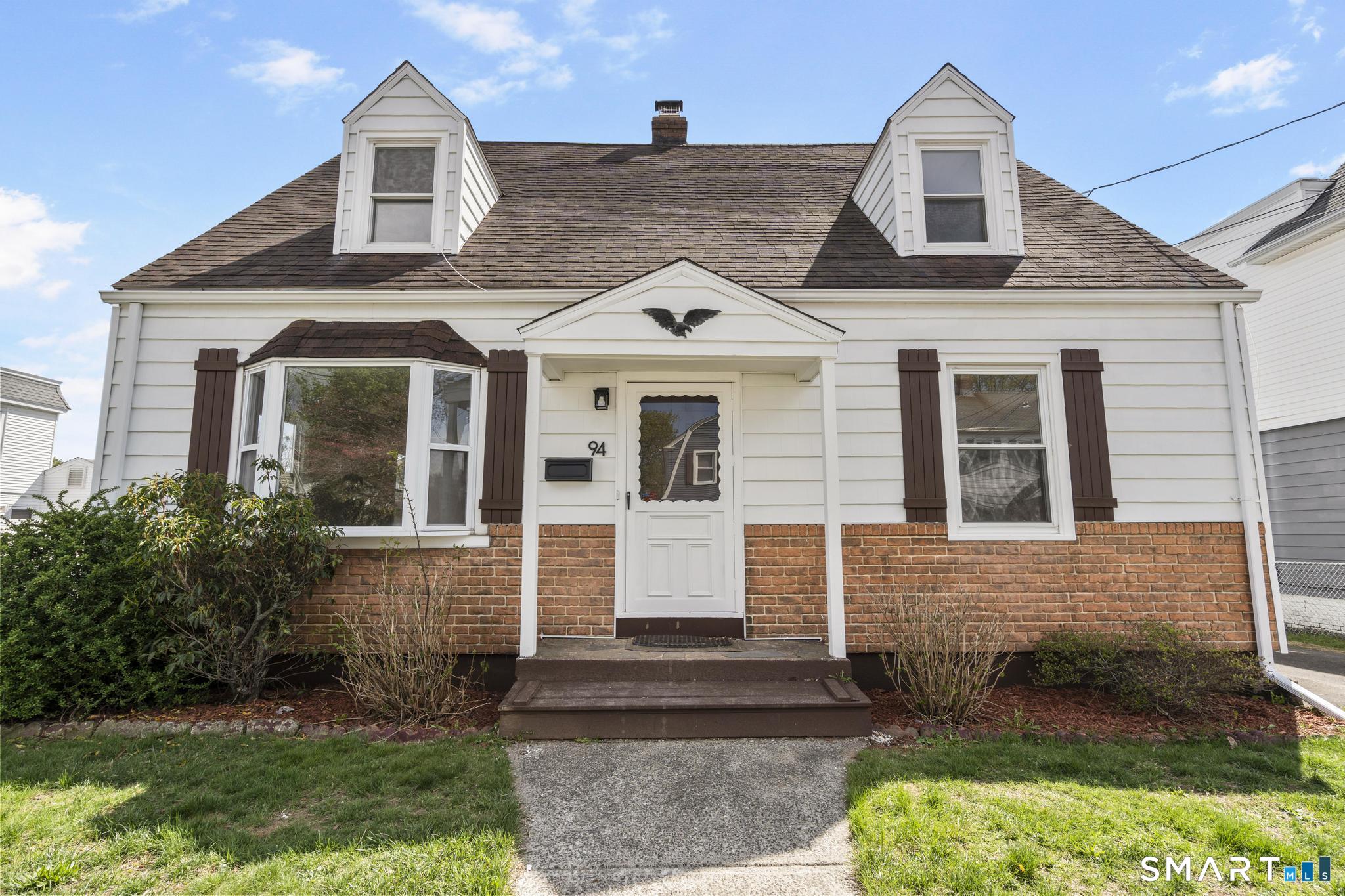 94 3rd Street Hamden, CT 06514 - Photo 2 of 30 a front view of a house with a yard