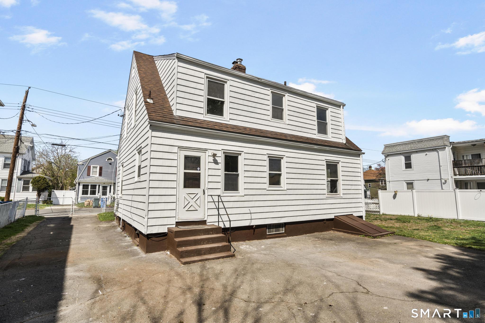 94 3rd Street Hamden, CT 06514 - Photo 26 of 30 a view of a house with a patio