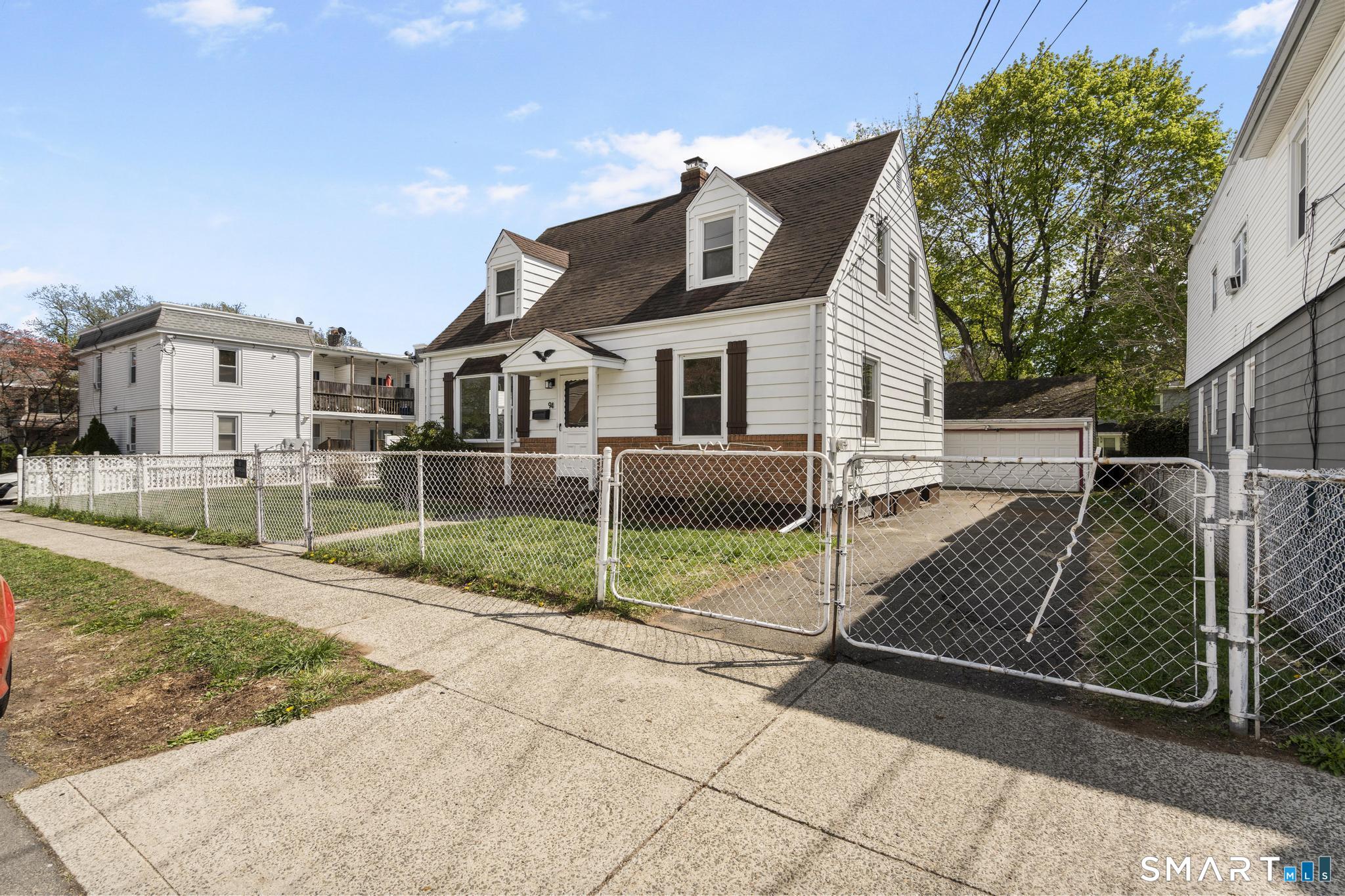 94 3rd Street Hamden, CT 06514 - Photo 3 of 30 a view of a house with a yard