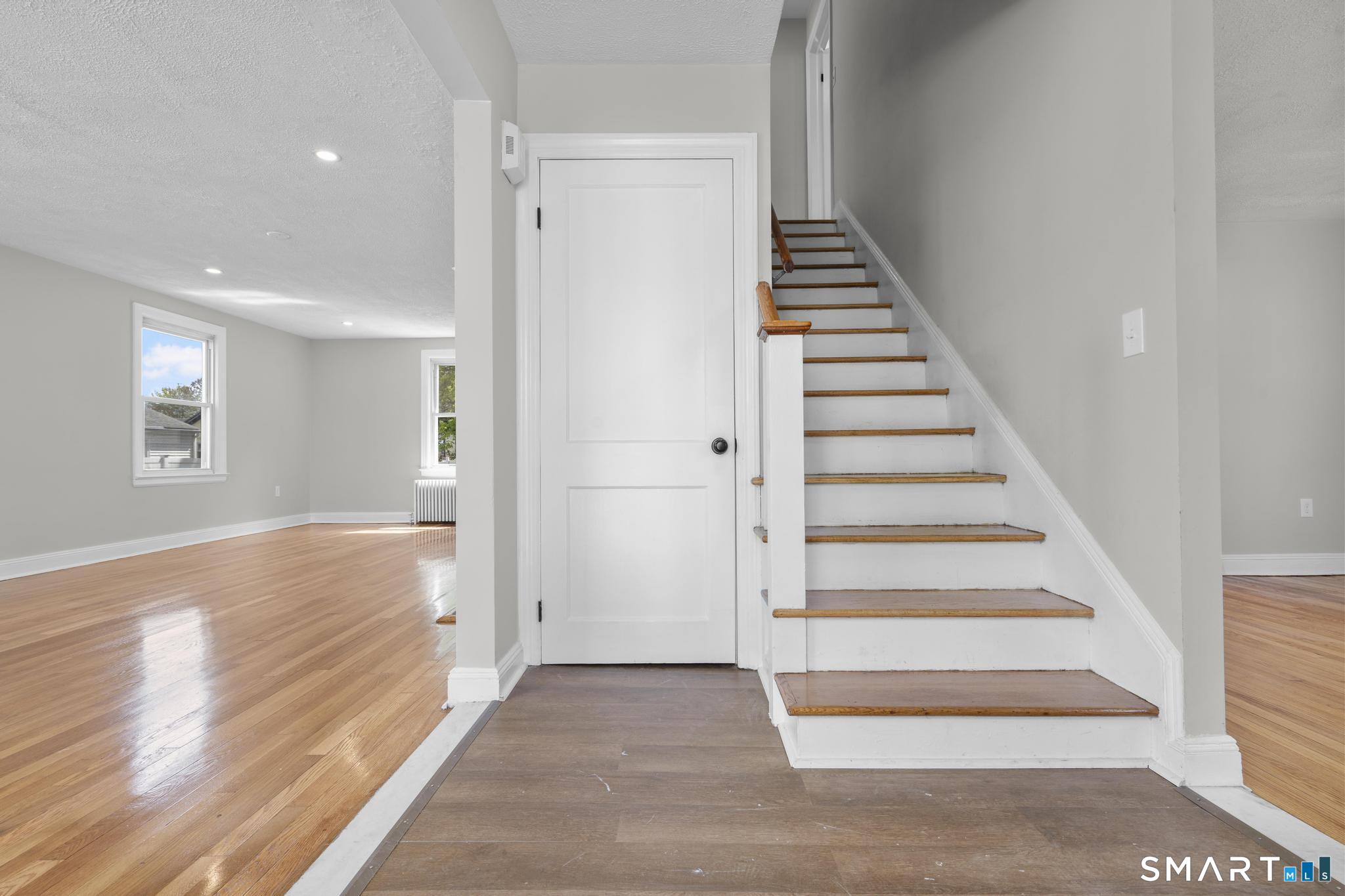 94 3rd Street Hamden, CT 06514 - Photo 4 of 30 a view of entryway and hall with wooden floor