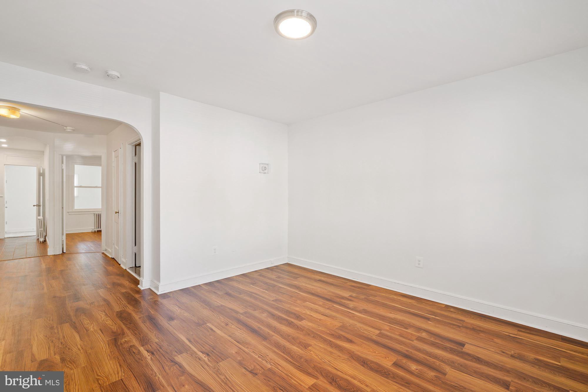 1612 17th Place Southeast Washington, DC 20020 - Photo 17 of 35 a view of a room with wooden floor and white walls