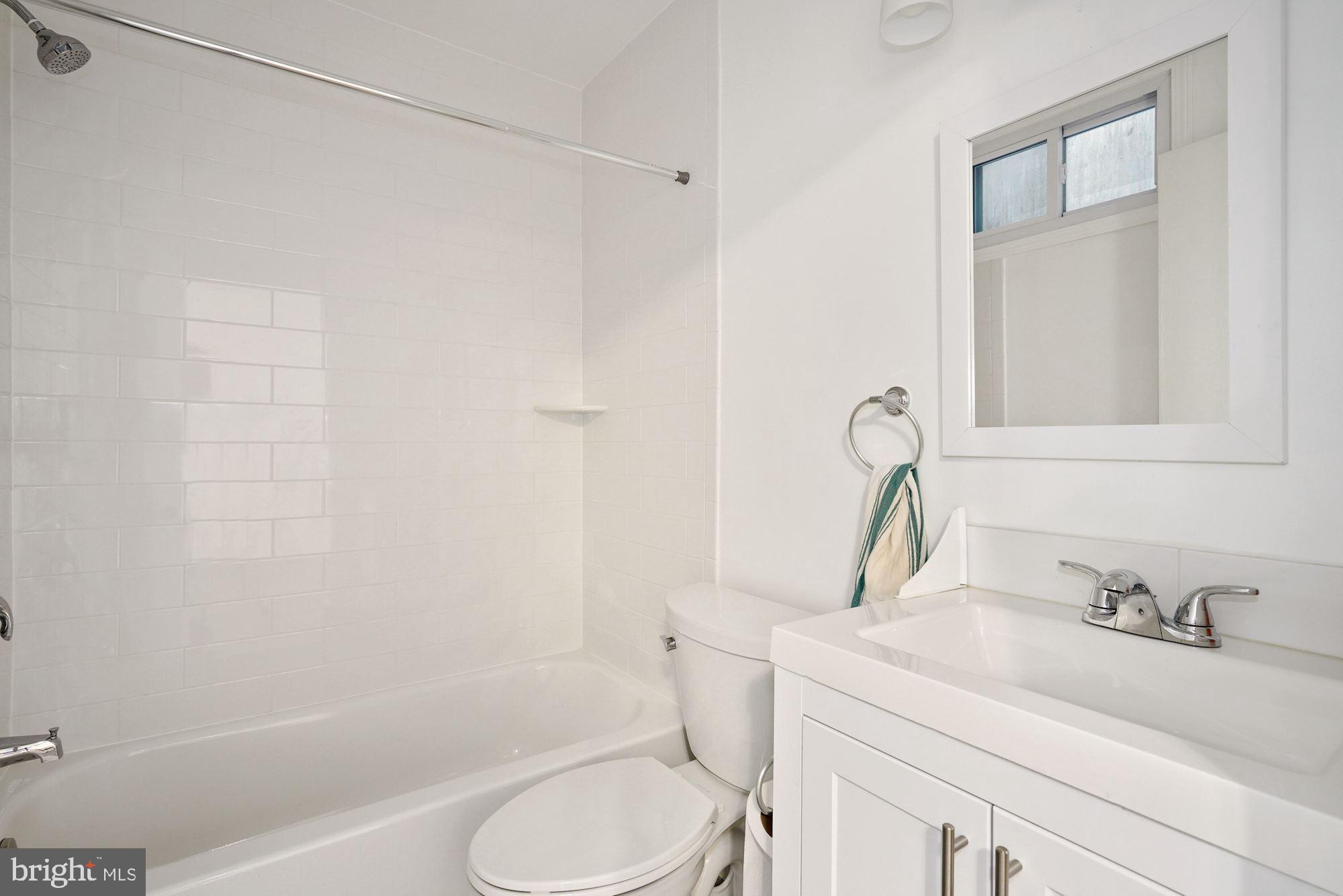 1612 17th Place Southeast Washington, DC 20020 - Photo 20 of 35 a bathroom with a sink toilet and shower