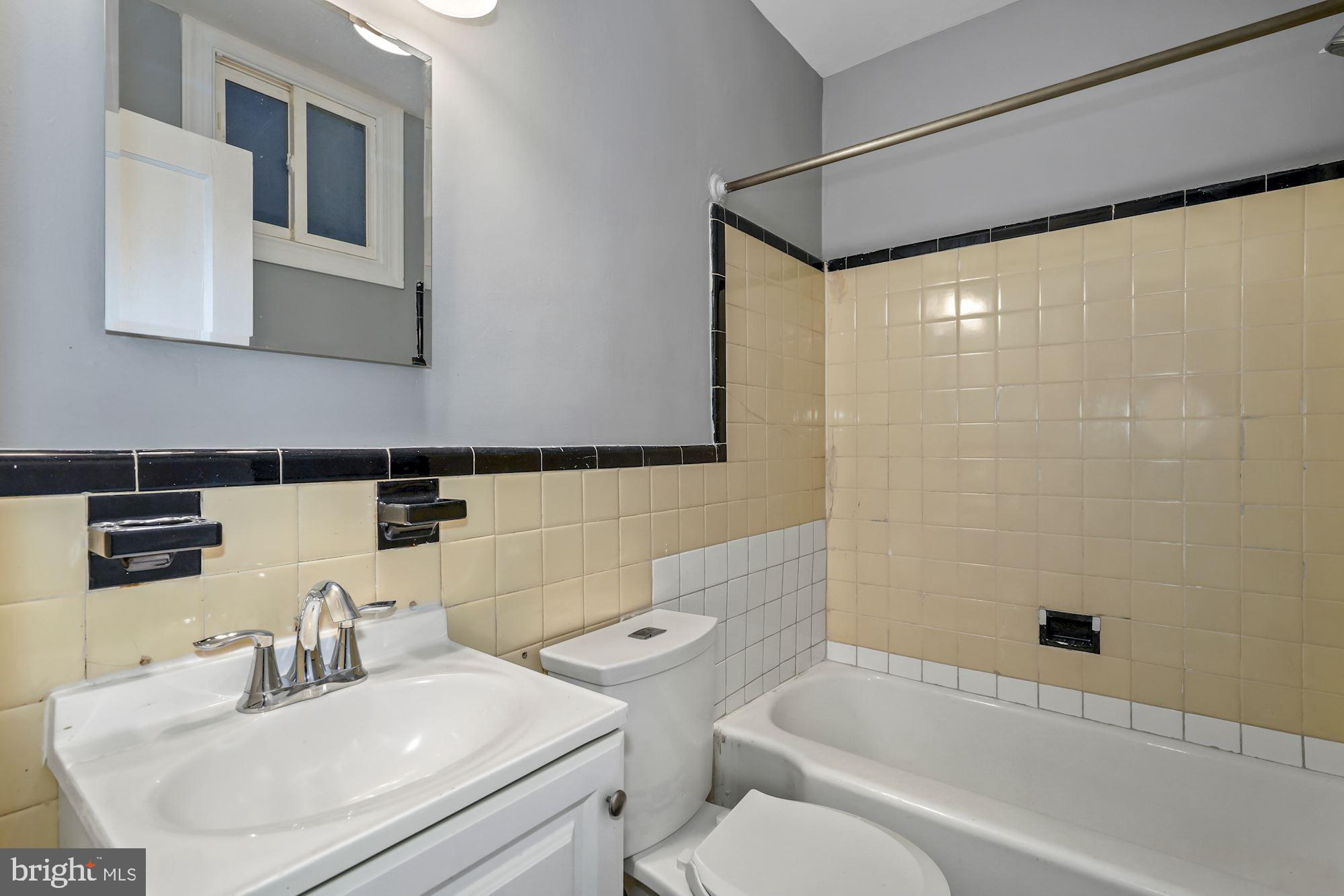 1612 17th Place Southeast Washington, DC 20020 - Photo 29 of 35 a bathroom with a sink toilet and shower