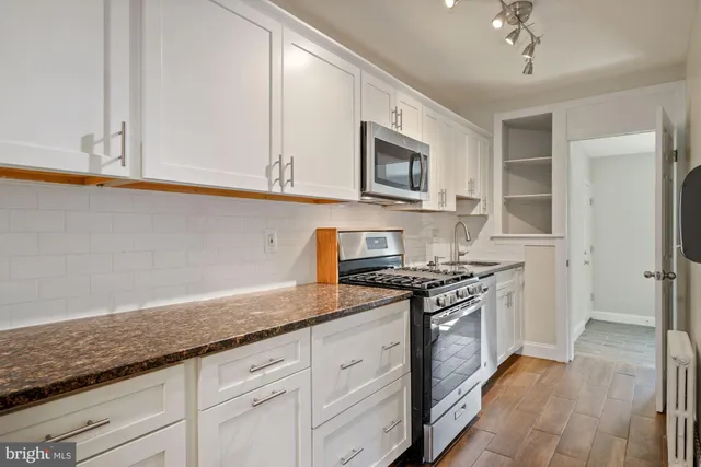 a view of kitchen with wooden floor