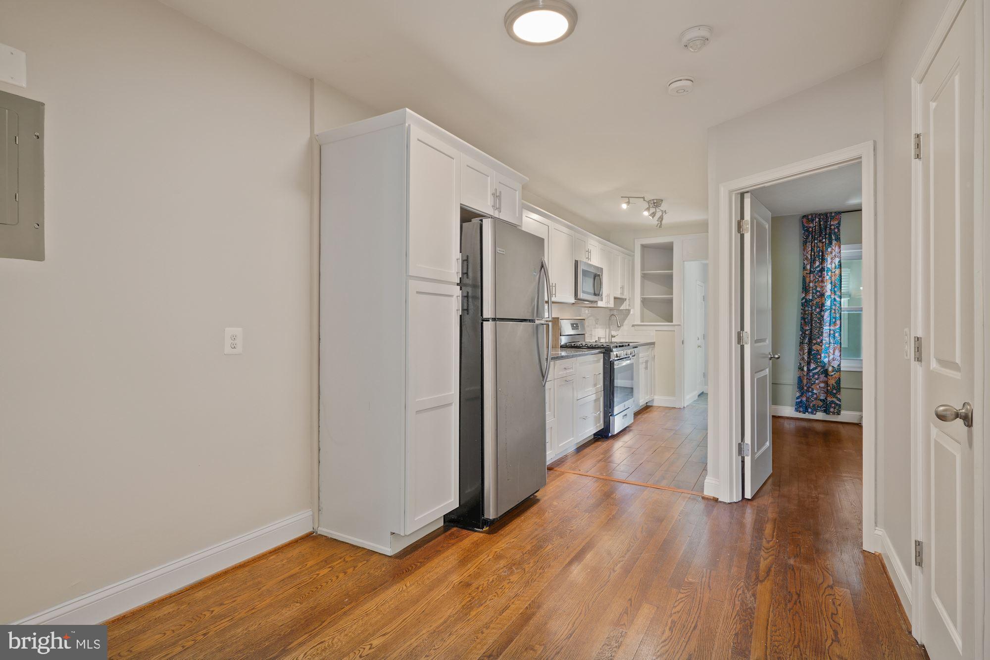 1612 17th Place Southeast Washington, DC 20020 - Photo 5 of 35 a view of kitchen with wooden floor