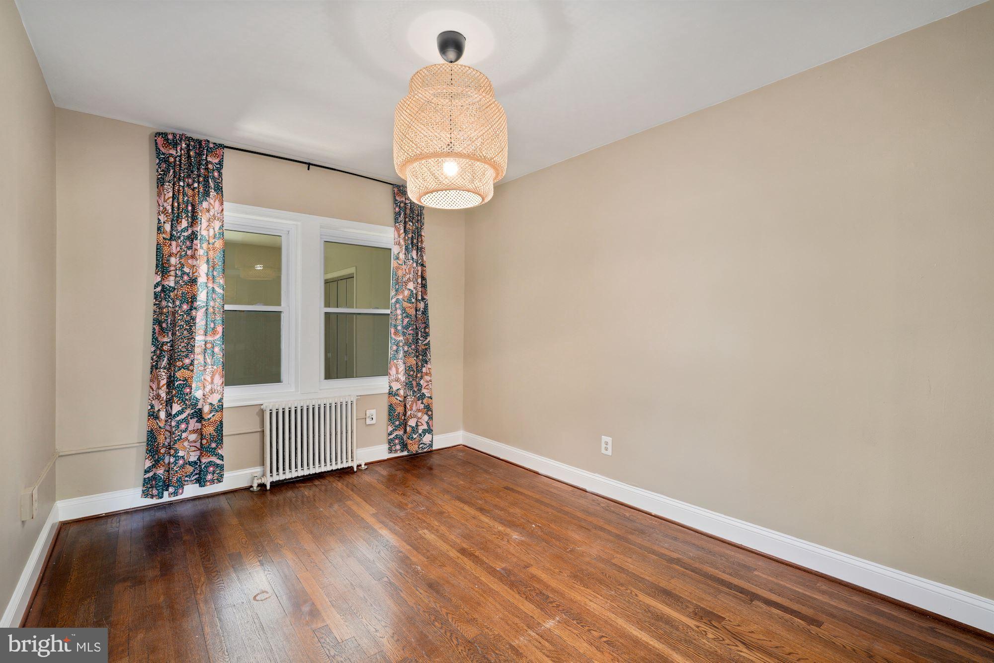 1612 17th Place Southeast Washington, DC 20020 - Photo 9 of 35 a view of empty room with wooden floor and fan