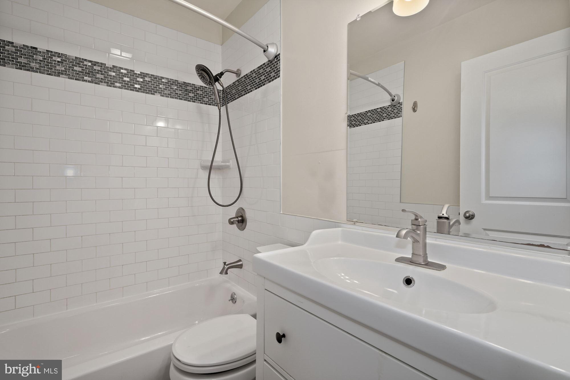 1612 17th Place Southeast Washington, DC 20020 - Photo 10 of 35 a bathroom with a sink a toilet and a bathtub