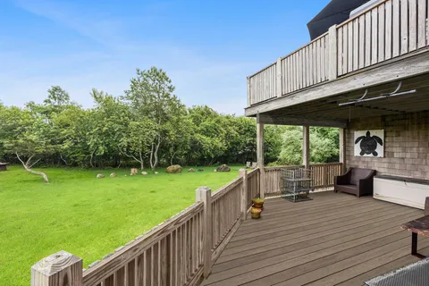 a view of a deck with wooden floor and outer view