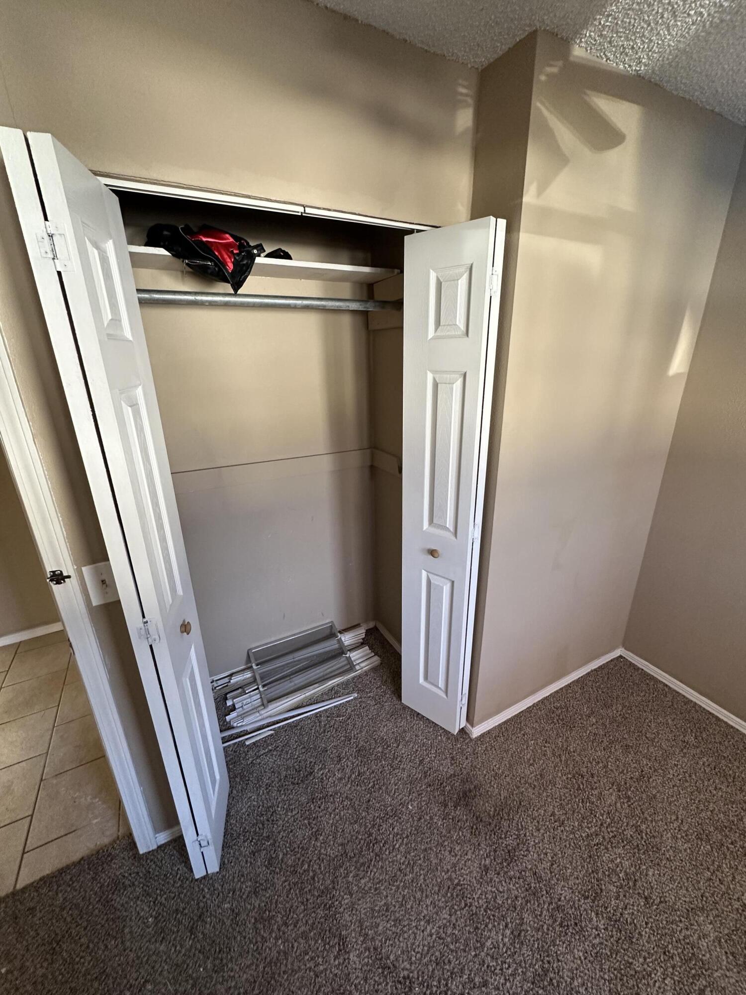 2416 47th Street Lubbock, TX 79412 - Photo 12 of 23 an empty room with staircase