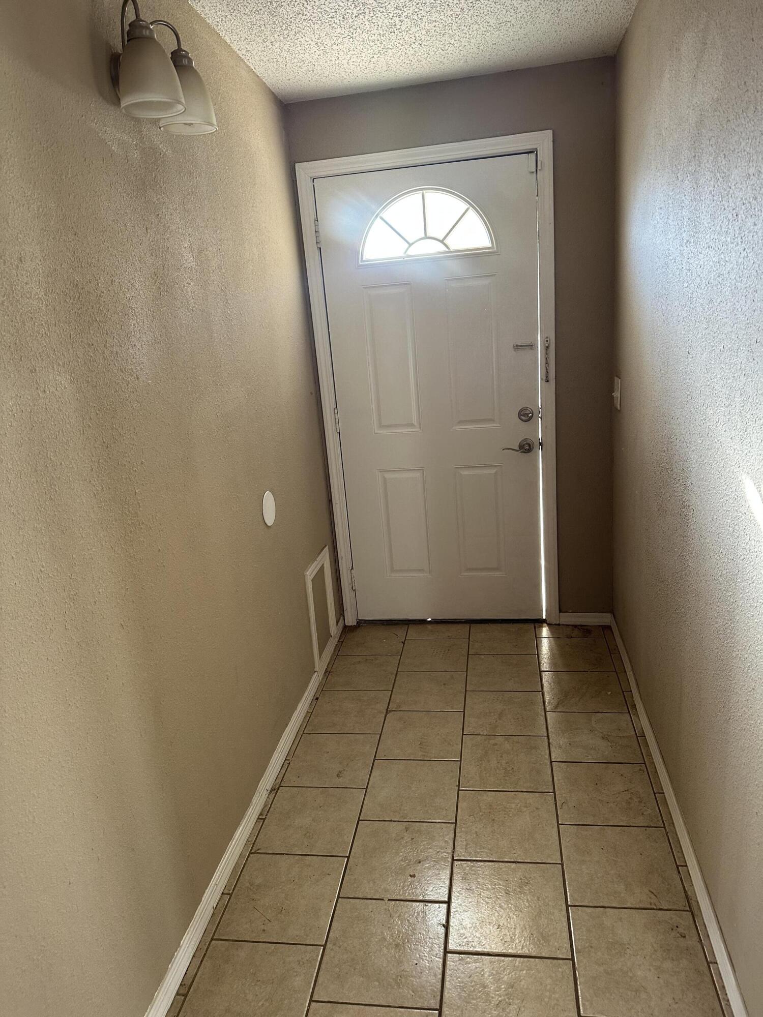 2416 47th Street Lubbock, TX 79412 - Photo 2 of 23 an empty room with windows
