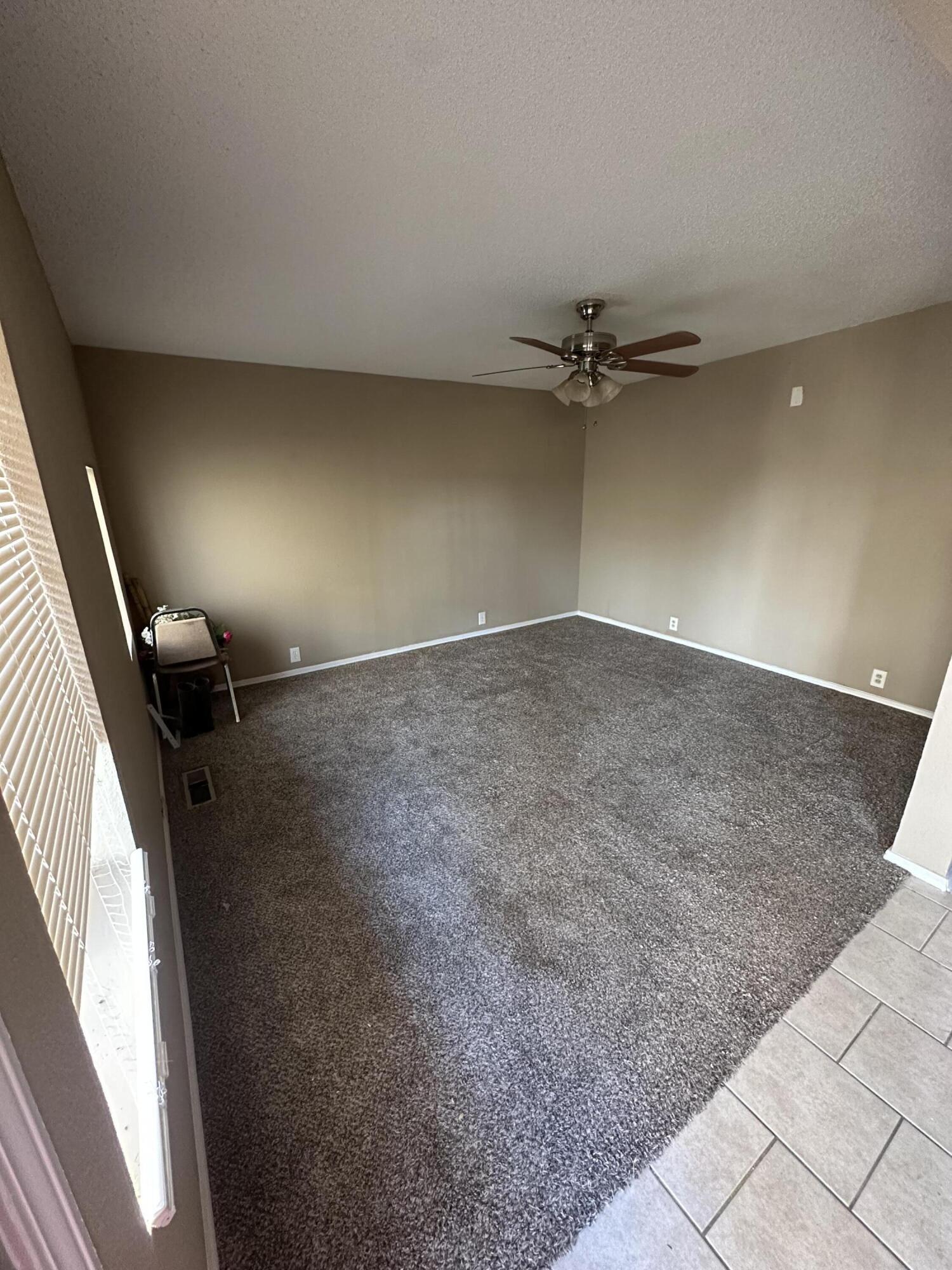 2416 47th Street Lubbock, TX 79412 - Photo 6 of 23 en view of a livingroom with a ceiling fan