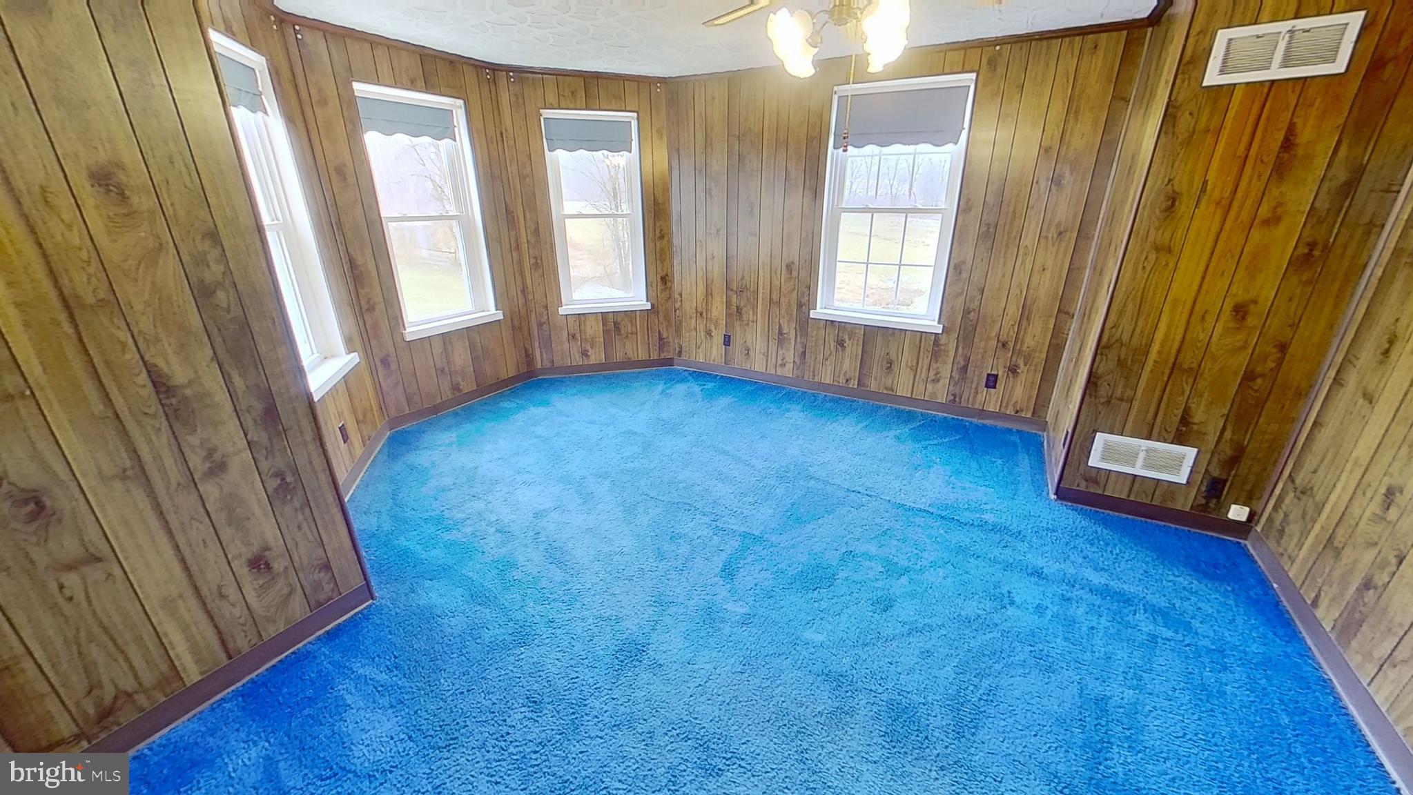 6250 Sterner Drive Spring Grove, PA 17362 - Photo 7 of 16 a view of an empty room with a window and hardwood floor