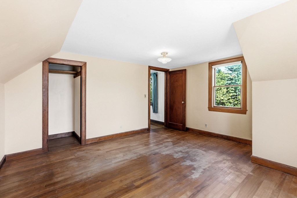 17 Moose Brook Road Southampton, MA 01073 - Photo 21 of 38 an empty room with wooden floor and a window
