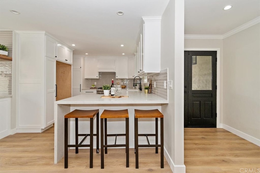 14101 Cameron Lane North Tustin, CA 92705 - Photo 12 of 36 a kitchen with stainless steel appliances sink a stove and cabinets