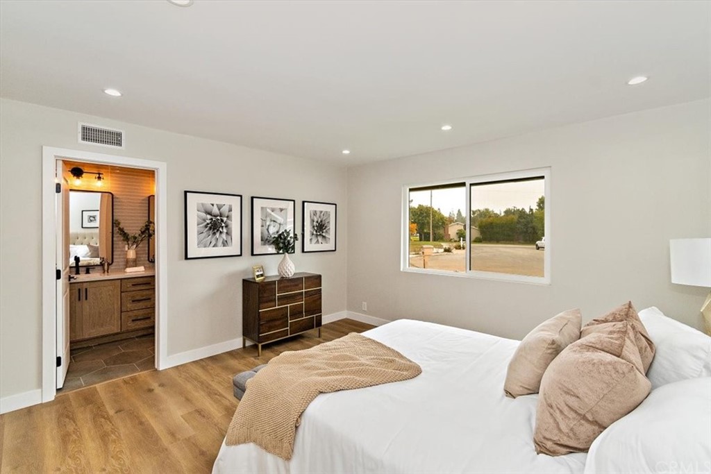 14101 Cameron Lane North Tustin, CA 92705 - Photo 19 of 36 a spacious bedroom with a bed and a cabinets