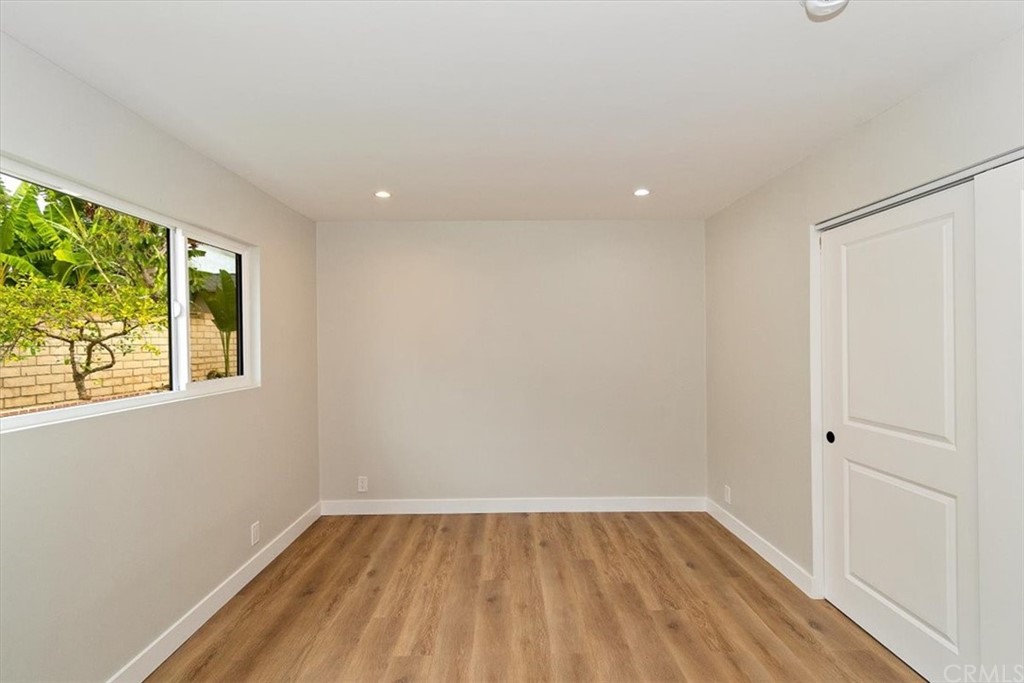 14101 Cameron Lane North Tustin, CA 92705 - Photo 24 of 36 a view of a hallway with wooden floor