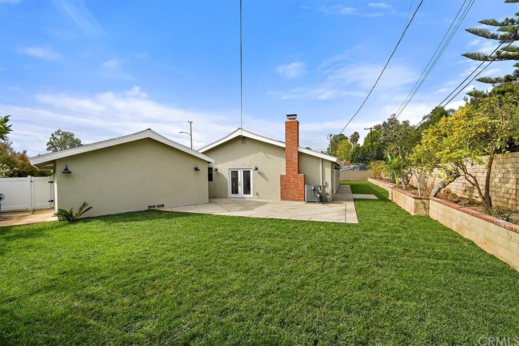 14101 Cameron Lane North Tustin, CA 92705 - Photo 32 of 36 a green field with some trees in the background
