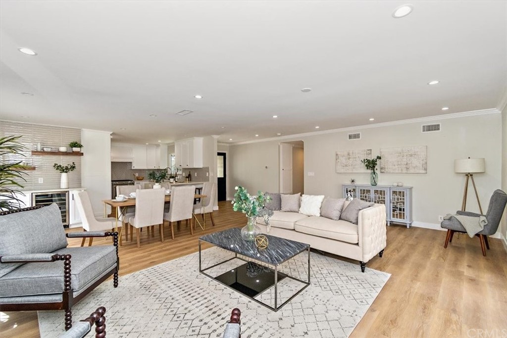 14101 Cameron Lane North Tustin, CA 92705 - Photo 6 of 36 a living room with furniture wooden floor and a fireplace