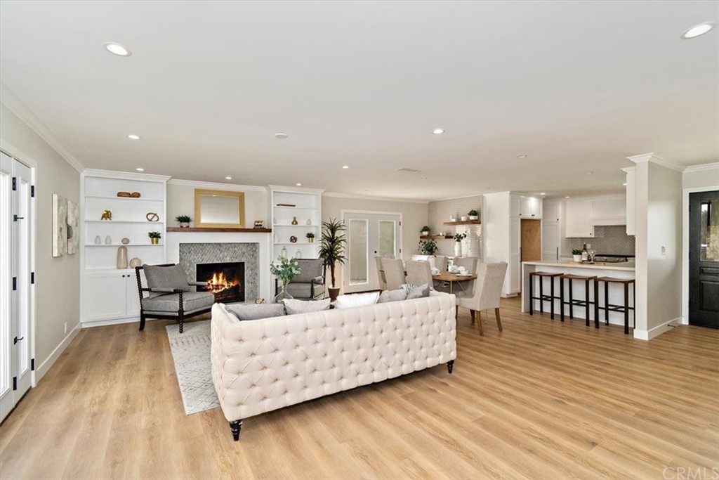 14101 Cameron Lane North Tustin, CA 92705 - Photo 7 of 36 a living room with furniture a fireplace and a table