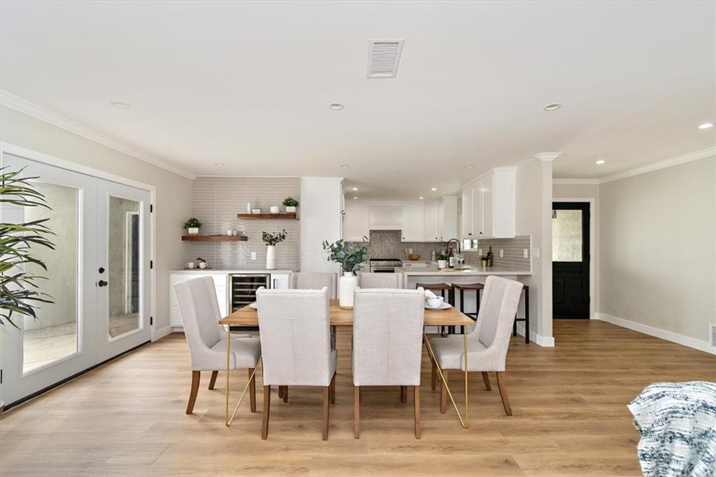 14101 Cameron Lane North Tustin, CA 92705 - Photo 9 of 36 a kitchen with a white stove cabinets and wooden floor