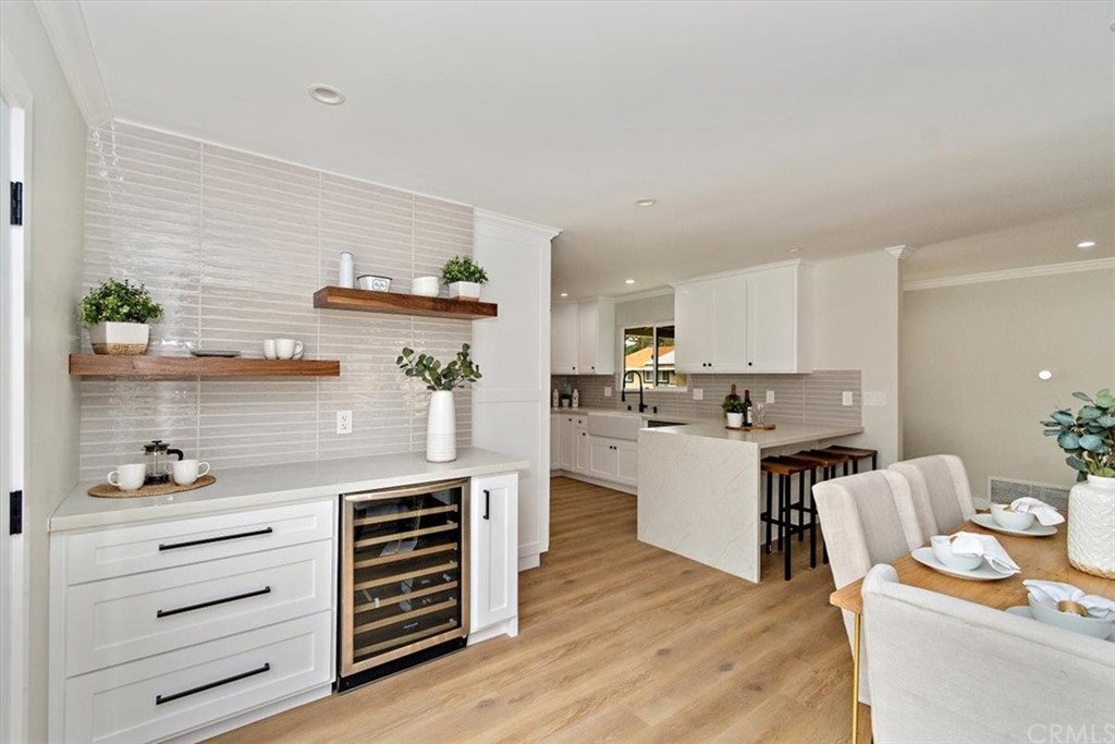 14101 Cameron Lane North Tustin, CA 92705 - Photo 10 of 36 a kitchen with stainless steel appliances granite countertop a sink stove and refrigerator