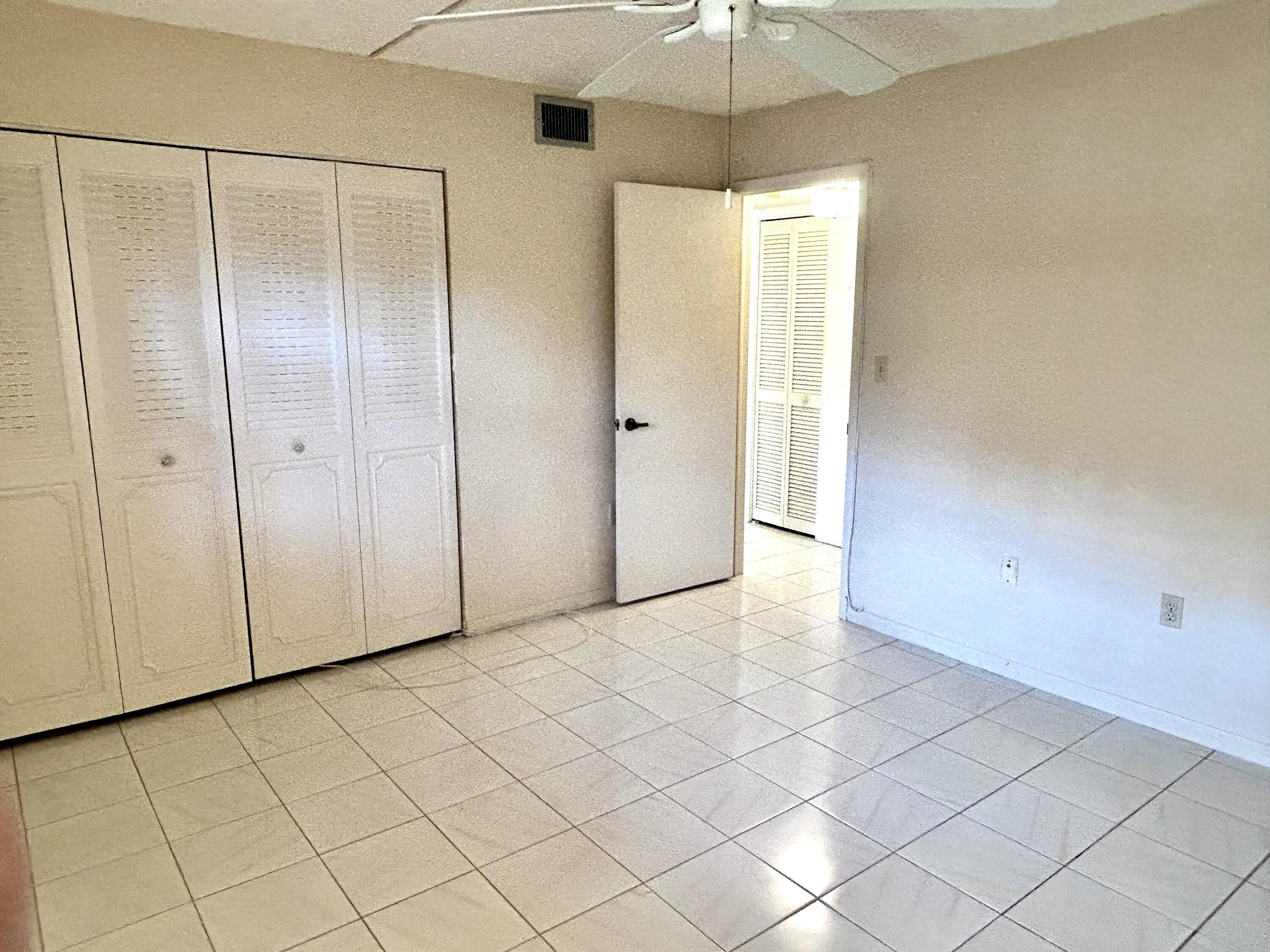 3930 Inverrary Boulevard, Unit 303D Lauderhill, FL 33319 - Photo 13 of 28 an empty room with fan
