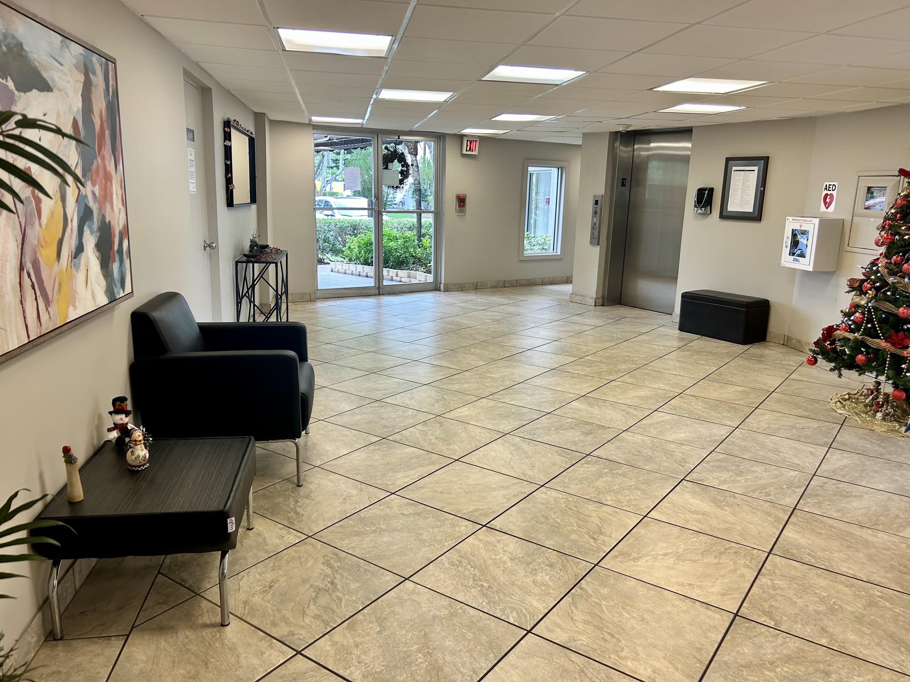 3930 Inverrary Boulevard, Unit 303D Lauderhill, FL 33319 - Photo 22 of 28 a view of a livingroom with furniture and a couch