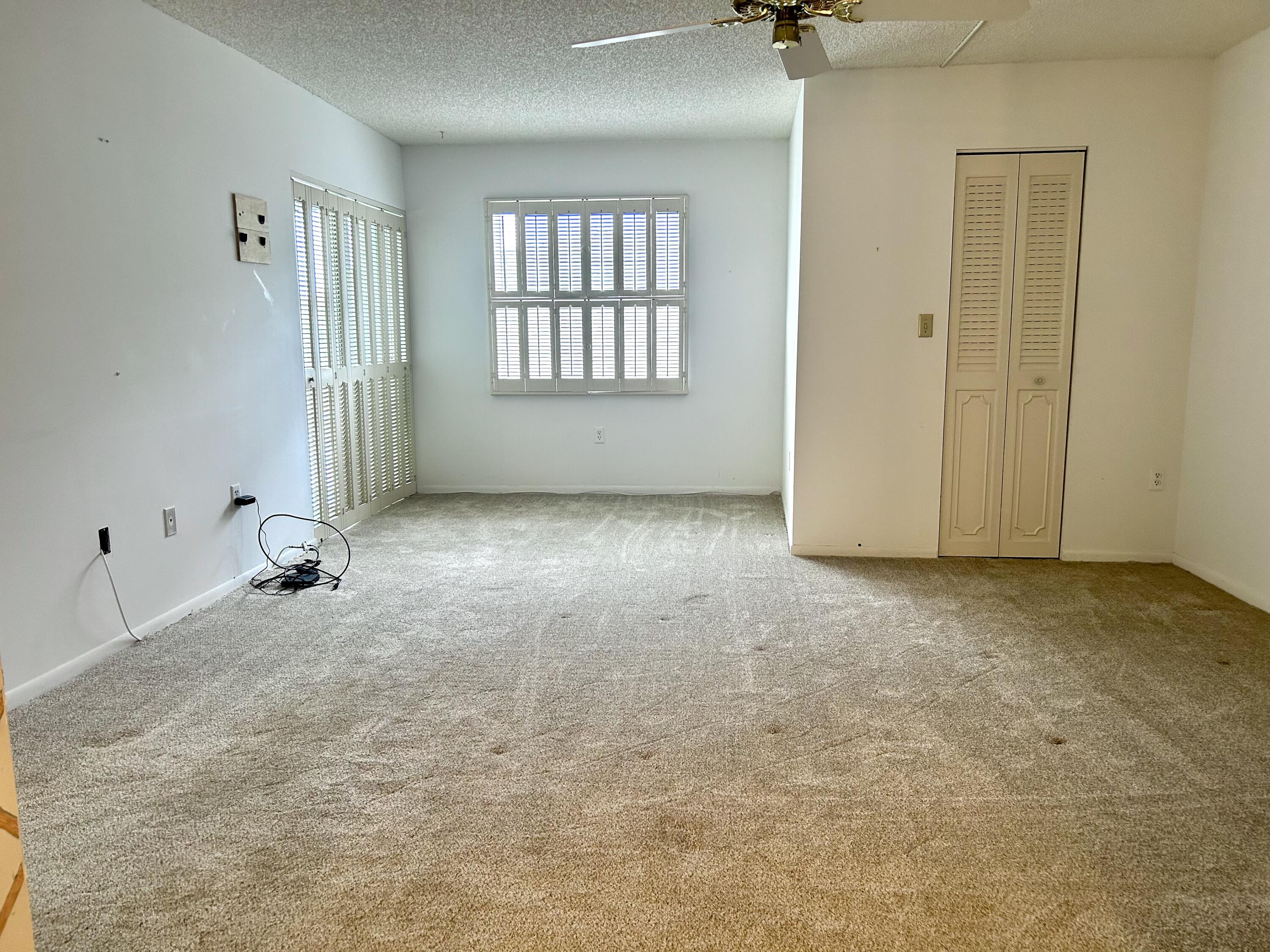 3930 Inverrary Boulevard, Unit 303D Lauderhill, FL 33319 - Photo 7 of 28 an empty room with windows