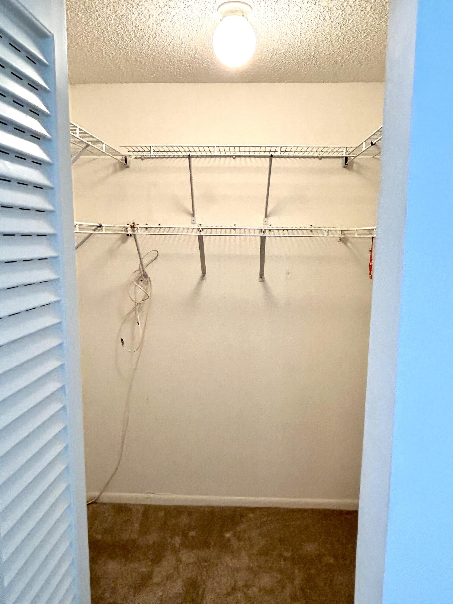 3930 Inverrary Boulevard, Unit 303D Lauderhill, FL 33319 - Photo 8 of 28 a bathroom with a glass shower door