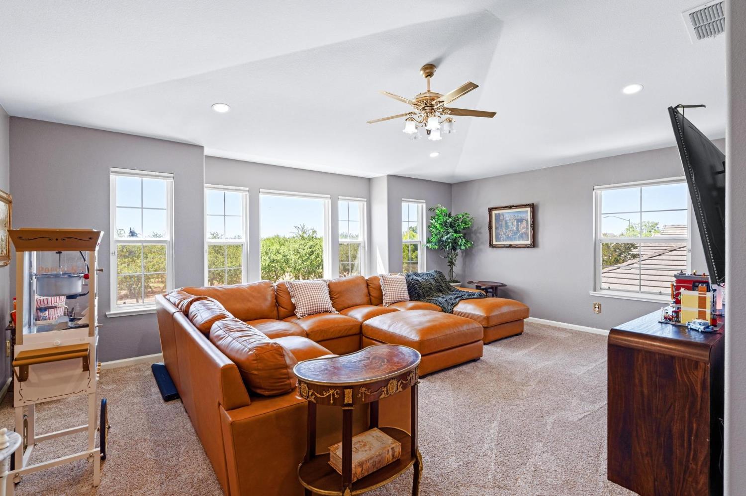 426 South Highland Avenue Ripon, CA 95366 - Photo 51 of 82 a living room with furniture and a flat screen tv