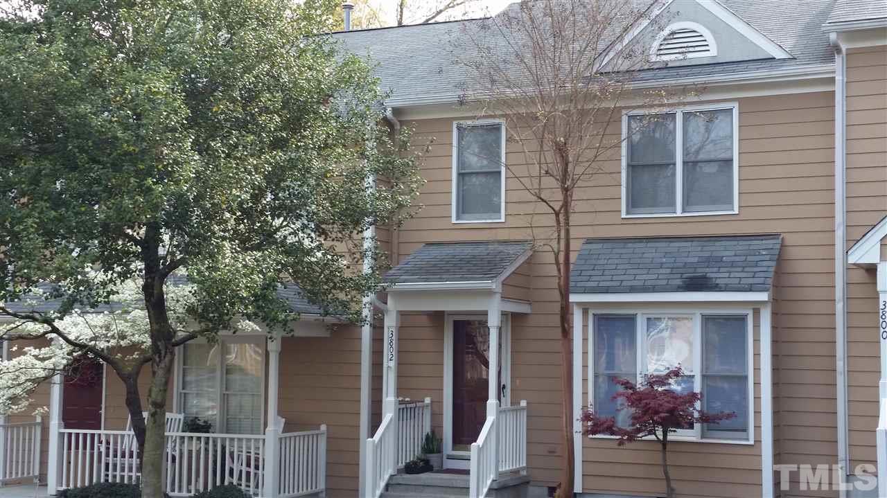 3802 Axle Lane Raleigh, NC 27616 - Photo 1 of 14 a view of a brick house with large windows and a large tree