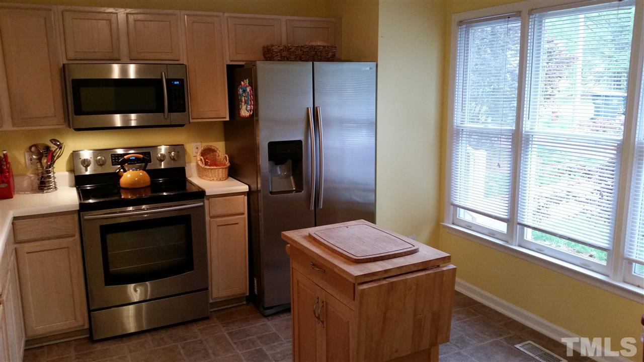 3802 Axle Lane Raleigh, NC 27616 - Photo 4 of 14 a kitchen with a stove and a microwave