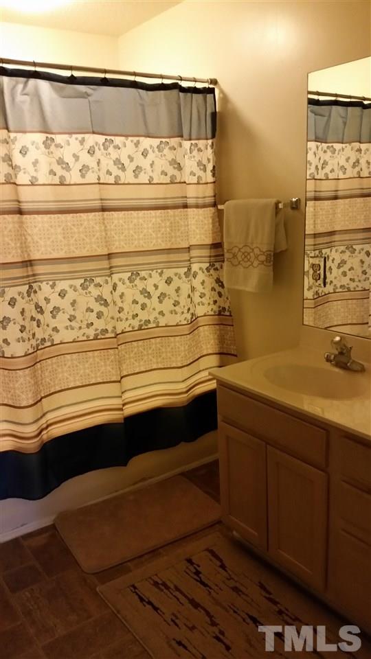 3802 Axle Lane Raleigh, NC 27616 - Photo 10 of 14 a bathroom with a sink and a mirror