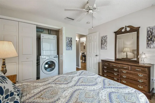 a view of a dining room with furniture and a chandelier