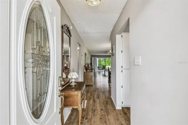 a kitchen with a refrigerator and a stove