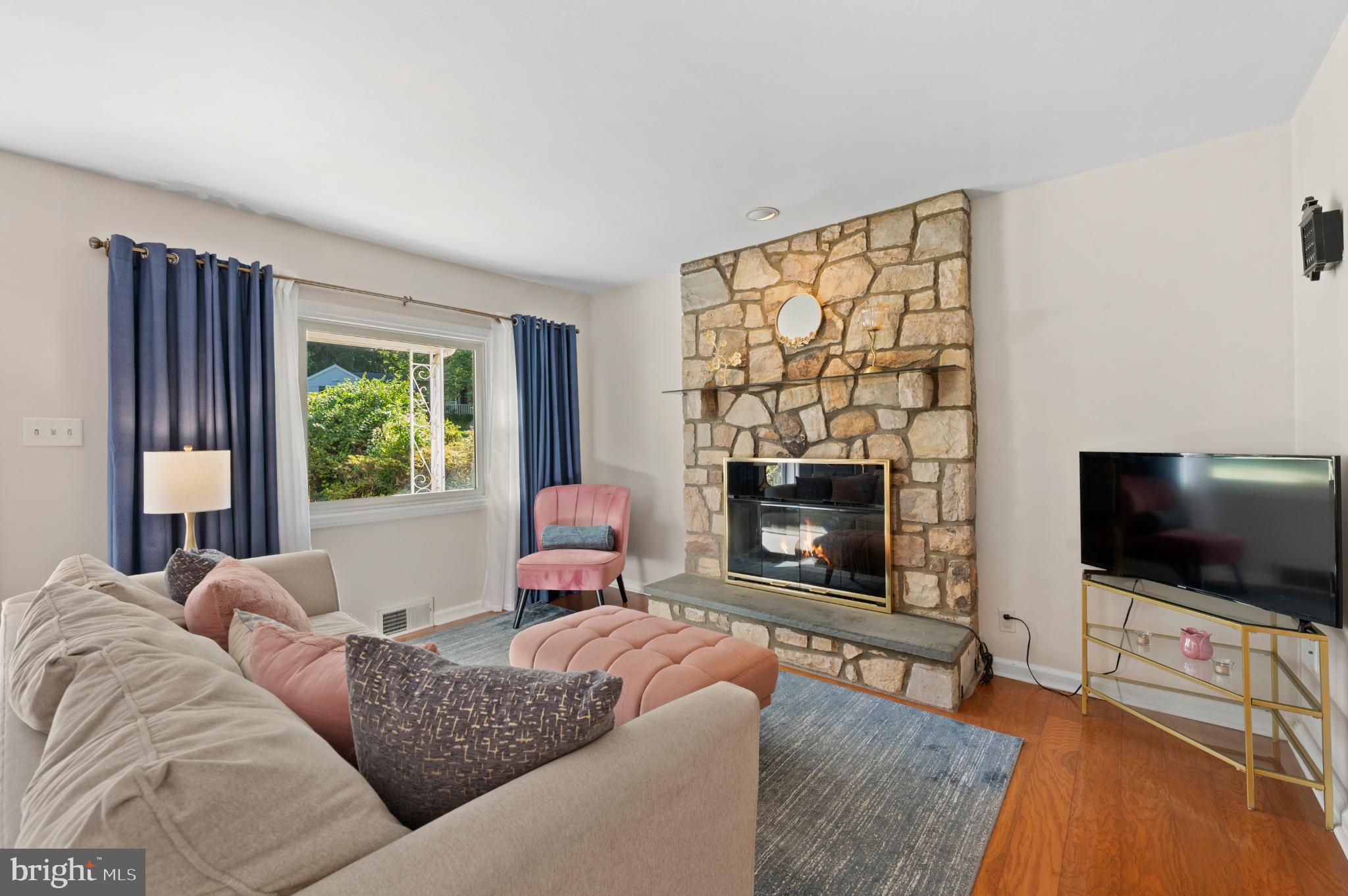 359 Valley-View Road King of Prussia, PA 19406 - Photo 20 of 51 Cozy living room with stone fireplace charm.