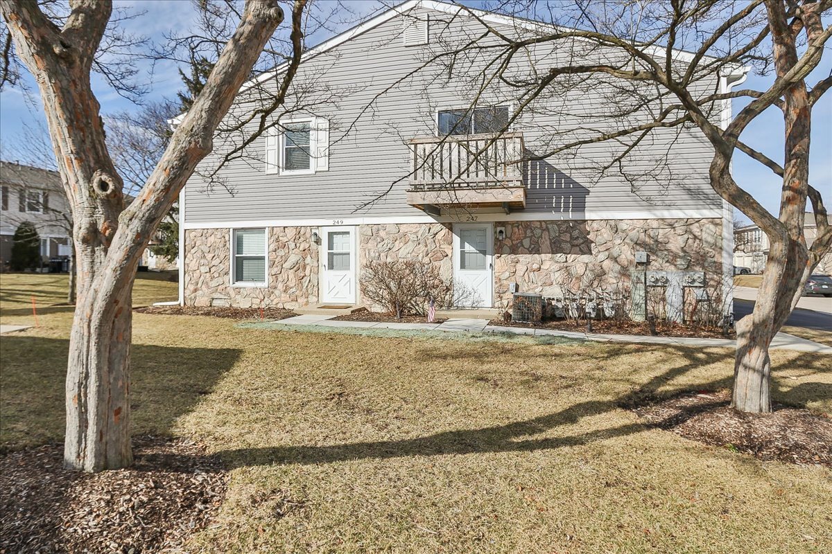 a view of a house with snow on the tree