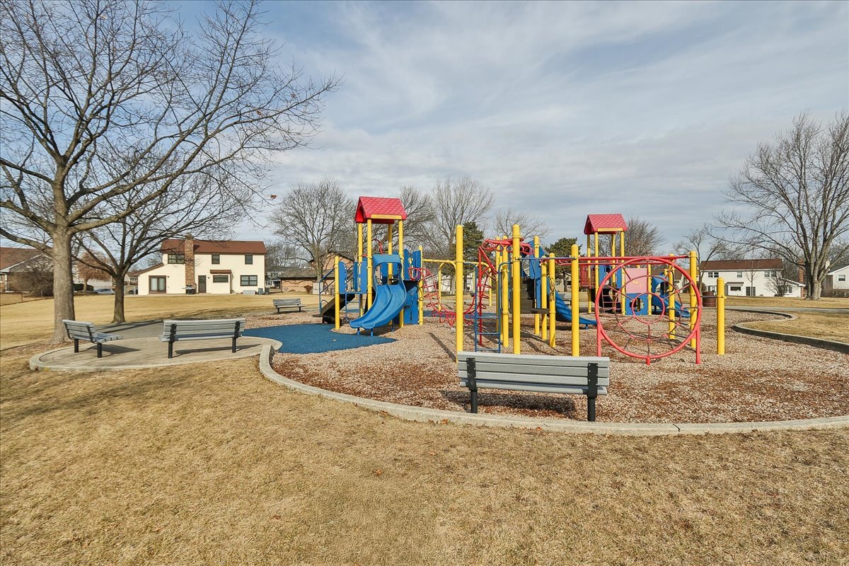 247 Nantucket Harbor Schaumburg, IL 60193 - Photo 23 of 25 a view of a park with swings and slides
