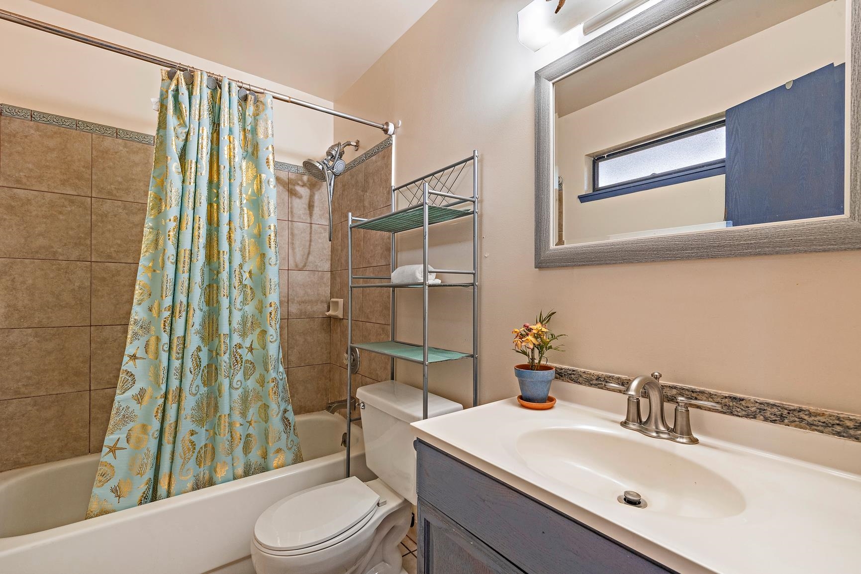 3740 Lower Honoapiilani Road, Unit G108 Lahaina, HI 96761 - Photo 14 of 24 a bathroom with a sink toilet and shower