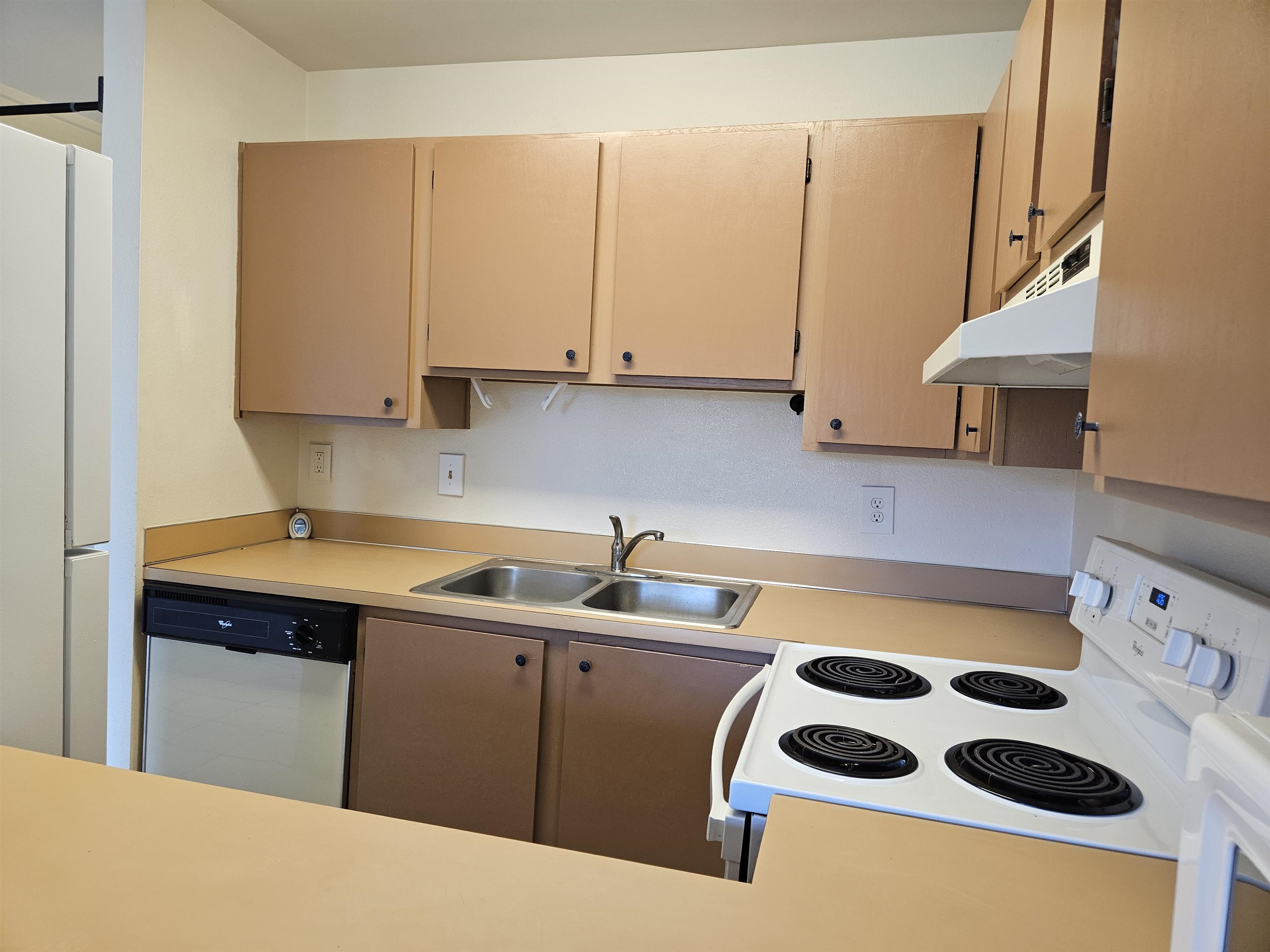 3740 Lower Honoapiilani Road, Unit G108 Lahaina, HI 96761 - Photo 8 of 24 a kitchen with a sink a stove and cabinets
