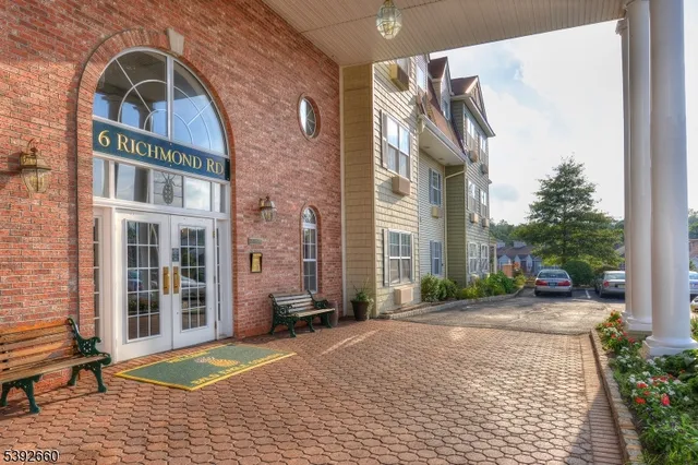 a view of pool with brick walls