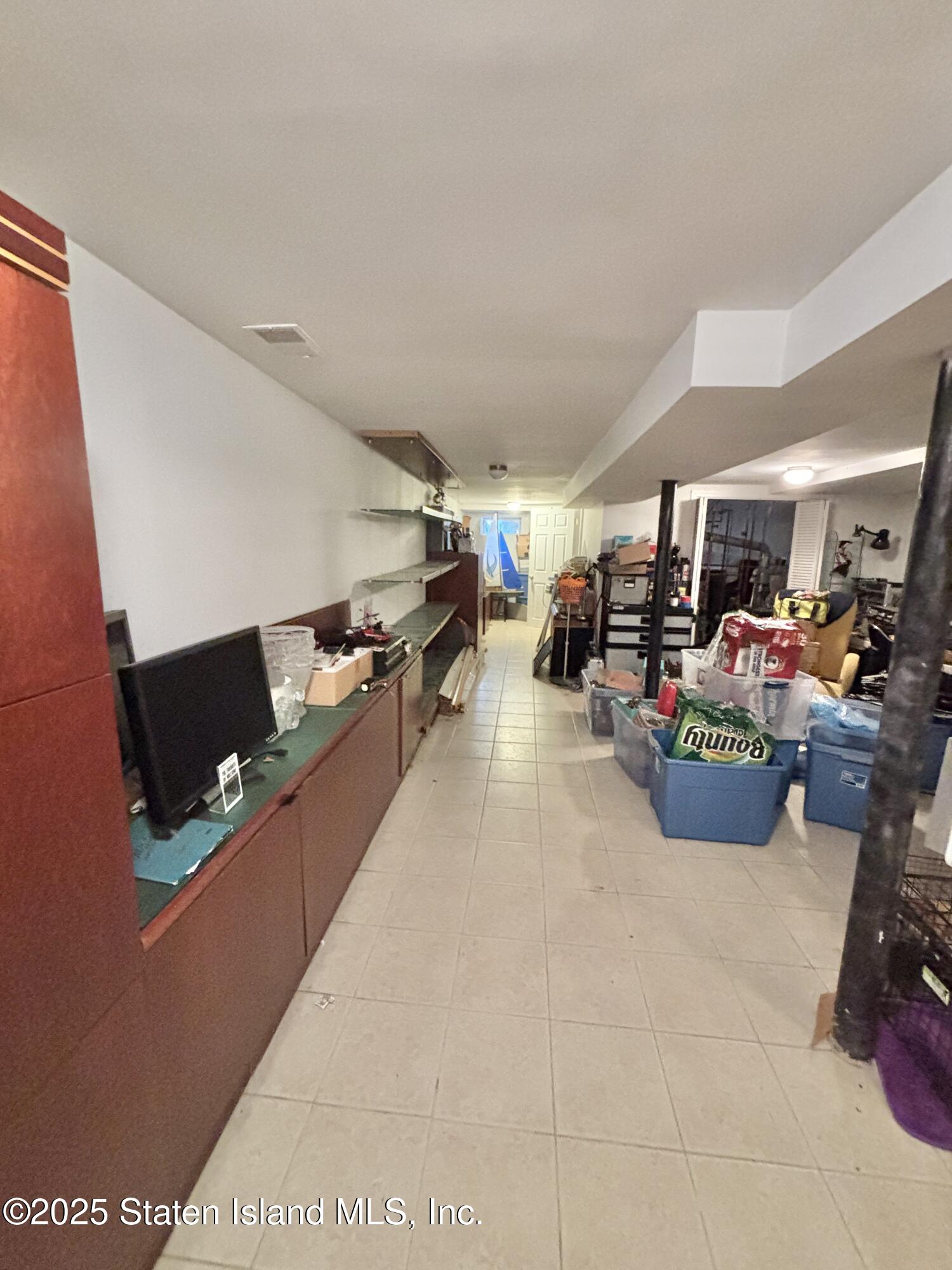 456 Oder Avenue Staten Island, NY 10304 - Photo 7 of 8 a room with lots of furniture and clutter