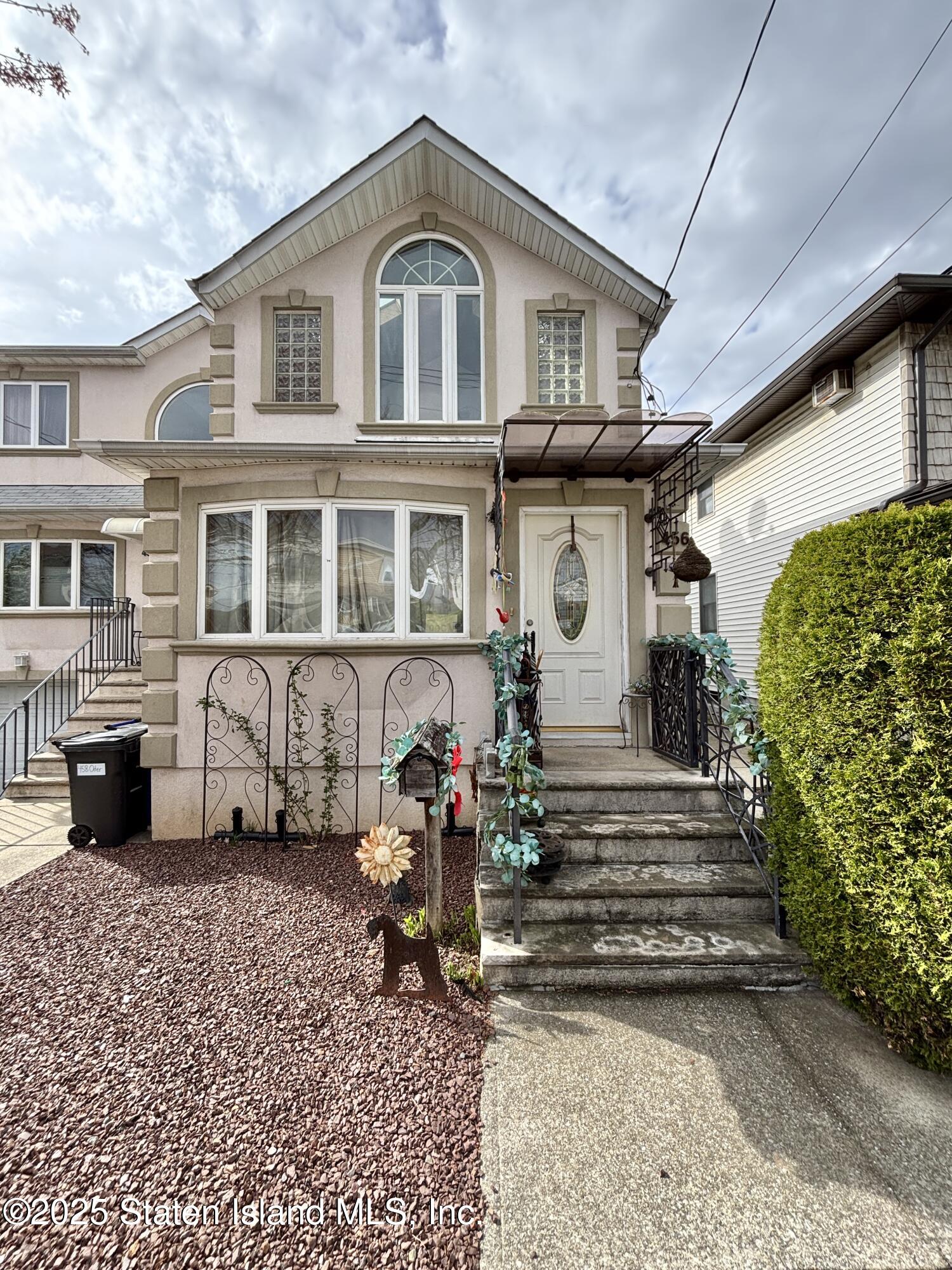 456 Oder Avenue Staten Island, NY 10304 - Photo 8 of 8 a front view of a house with a yard