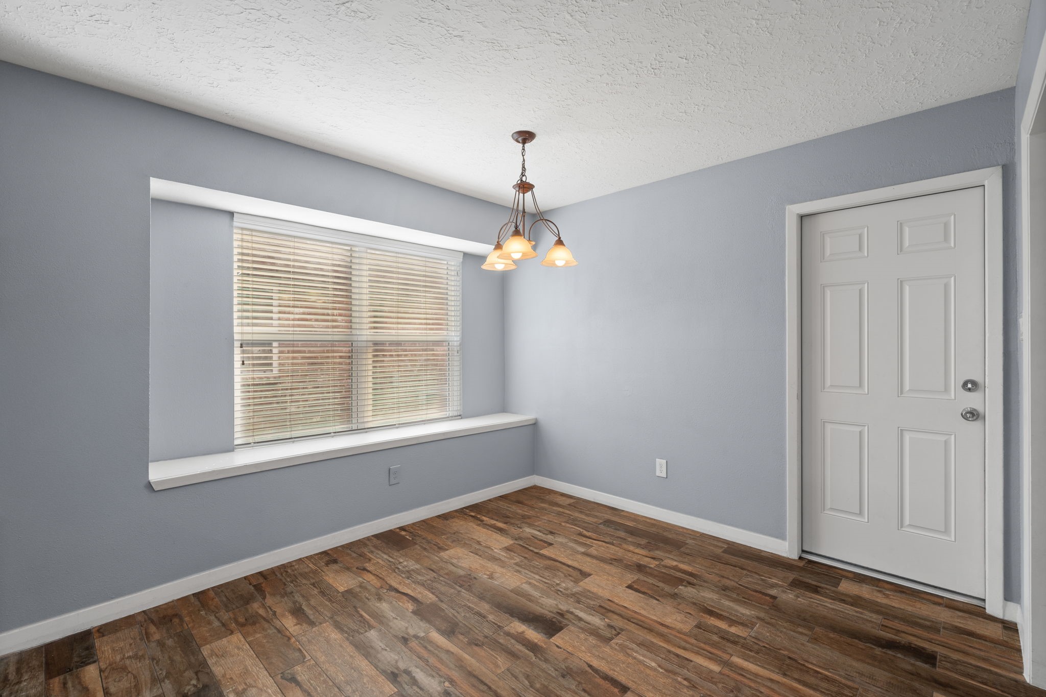 2622 Strait Lane Houston, TX 77084 - Photo 12 of 47 a view of empty room with wooden floor and fan