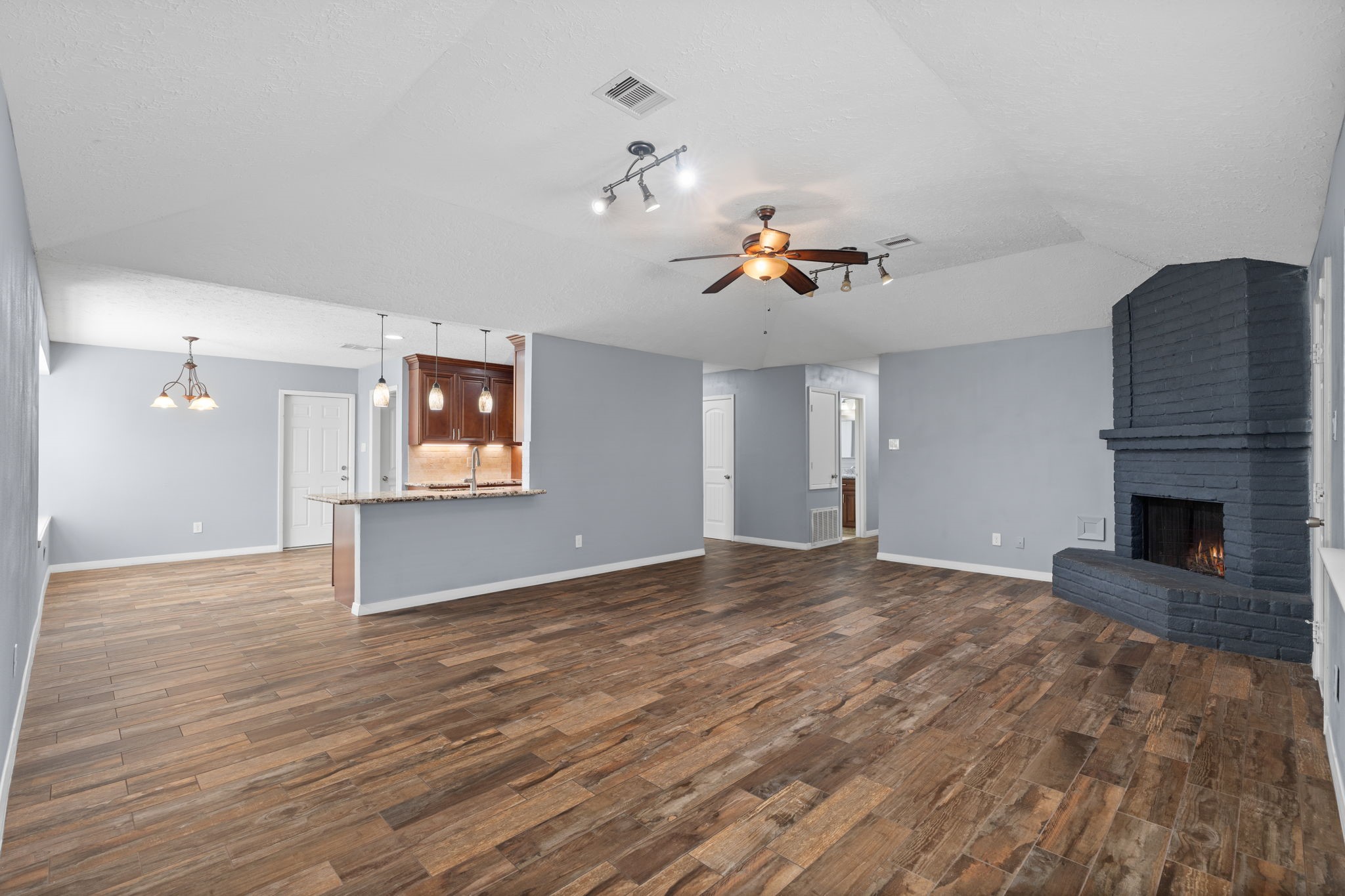 2622 Strait Lane Houston, TX 77084 - Photo 17 of 47 a view of empty room with wooden floor and fireplace