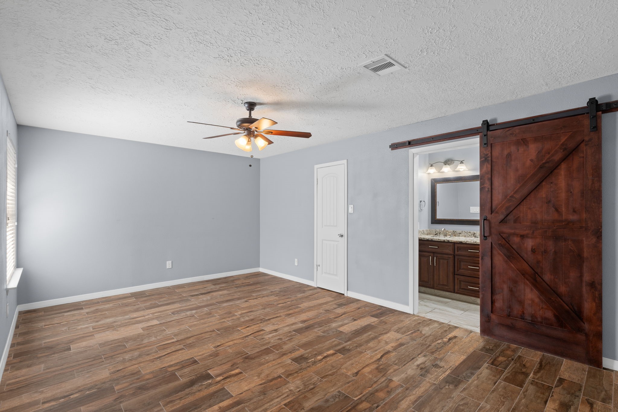2622 Strait Lane Houston, TX 77084 - Photo 18 of 47 a view of empty room with wooden floor and fan