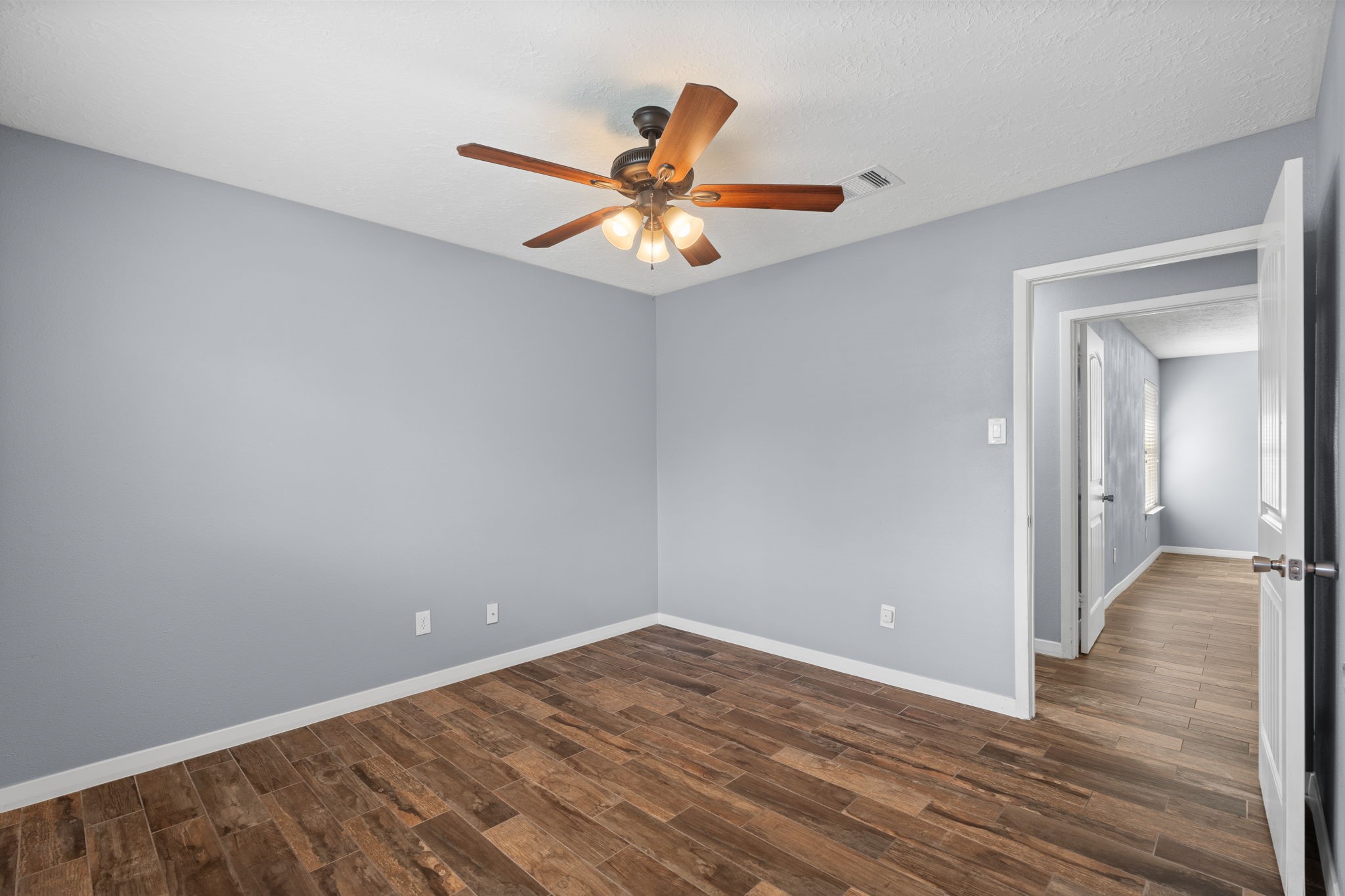 2622 Strait Lane Houston, TX 77084 - Photo 28 of 47 a view of empty room with wooden floor