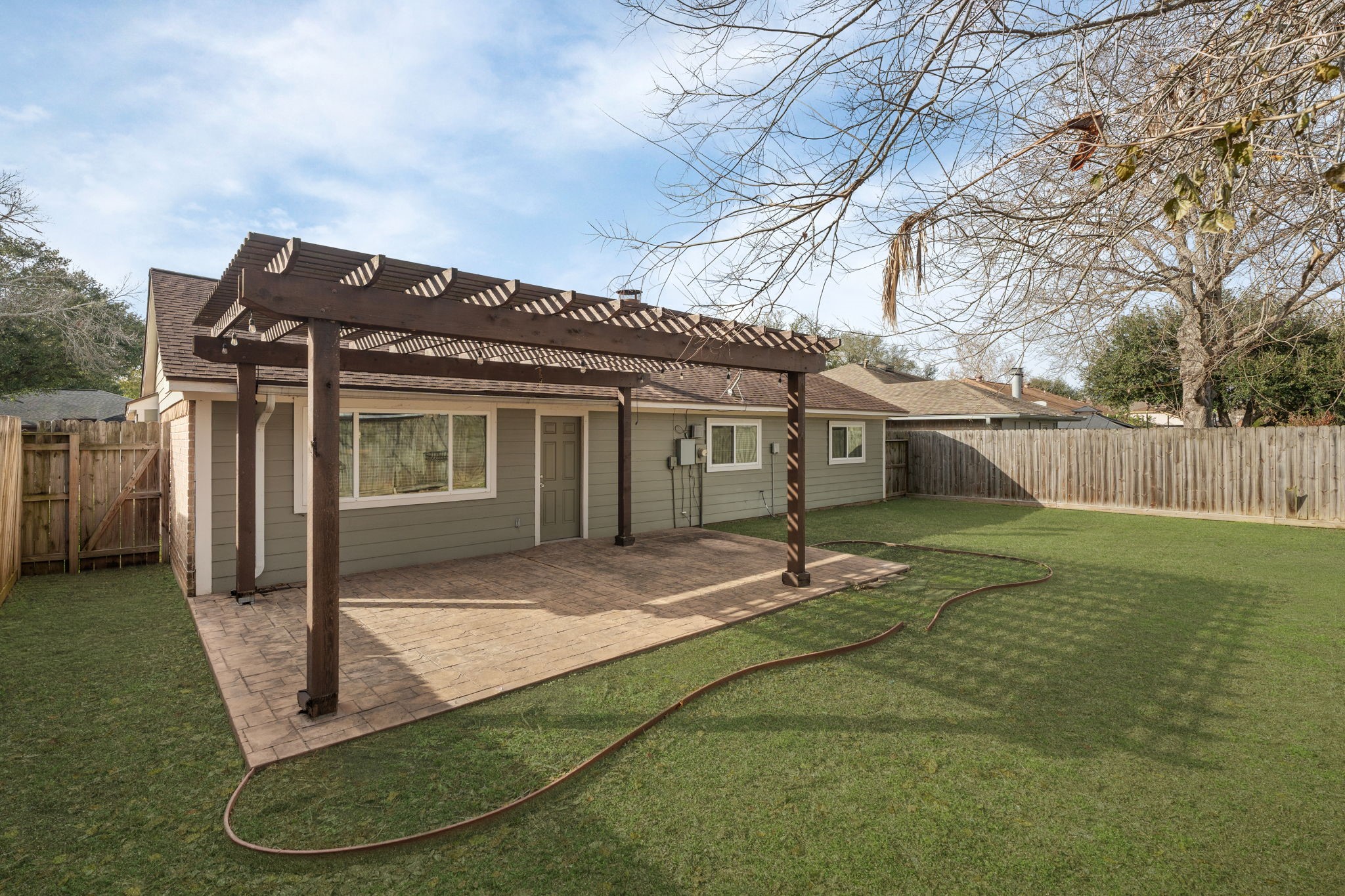 2622 Strait Lane Houston, TX 77084 - Photo 33 of 47 a backyard of a house with table and chairs