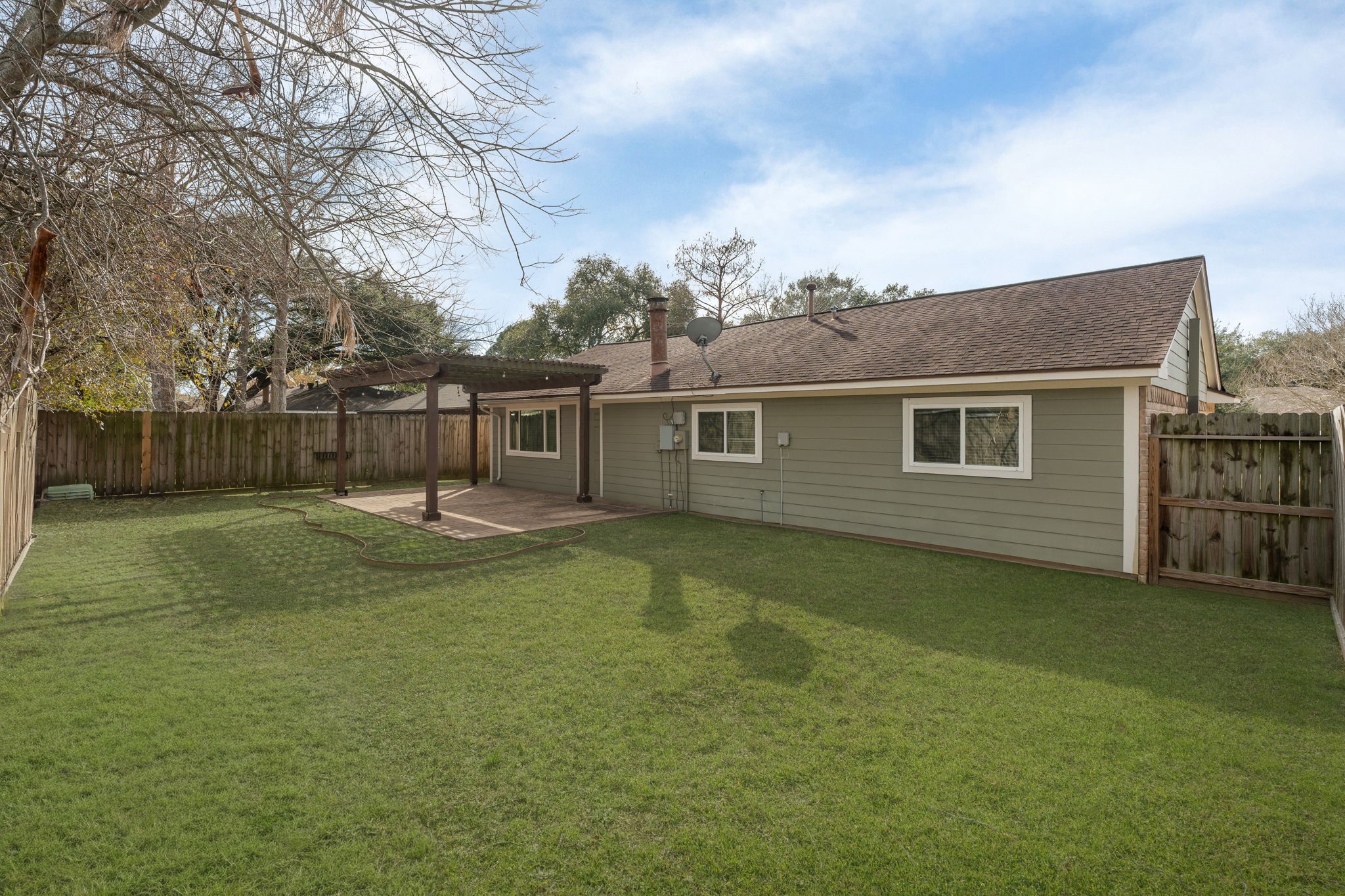 2622 Strait Lane Houston, TX 77084 - Photo 38 of 47 a view of a house with backyard and a tree